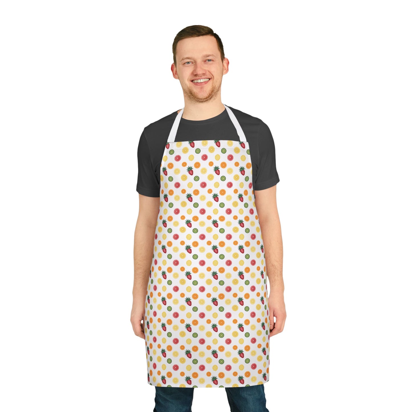 Apron, Fruit Slice Design, 5-Color Straps: A vibrant apron featuring a pattern of sliced oranges, lemons, pineapples, strawberries, and kiwi, worn by a smiling man, perfect for joyful cooking moments.