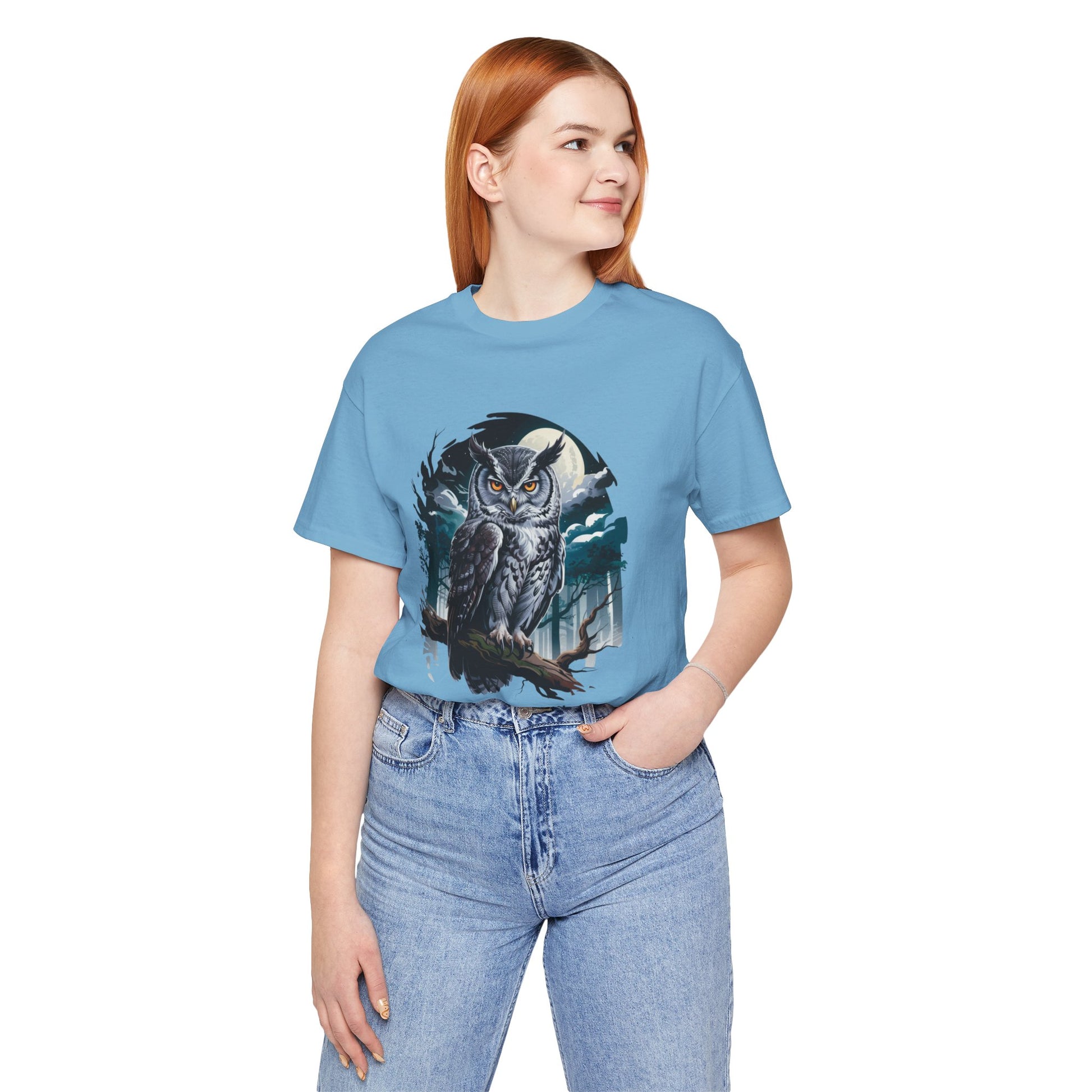 The Gray Owl: Hunt in Silence Bella+Canvas Unisex T-Shirt features a captivating owl print, worn by a model in a casual setting, emphasizing comfort and style from FireBrook Essentials.