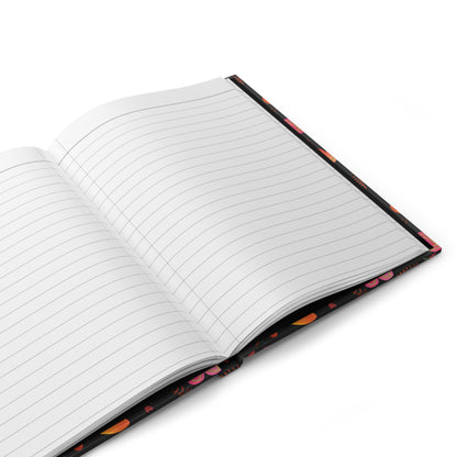 HARDCOVER JOURNAL, MATTE, RULED, 5X7, SEWN BIND, CLEAN-TEAR PAGES displayed open, showcasing lined pages with a vibrant floral-and-heart patterned cover. Ideal for stylish, joyful note-taking from FireBrook Designs.
