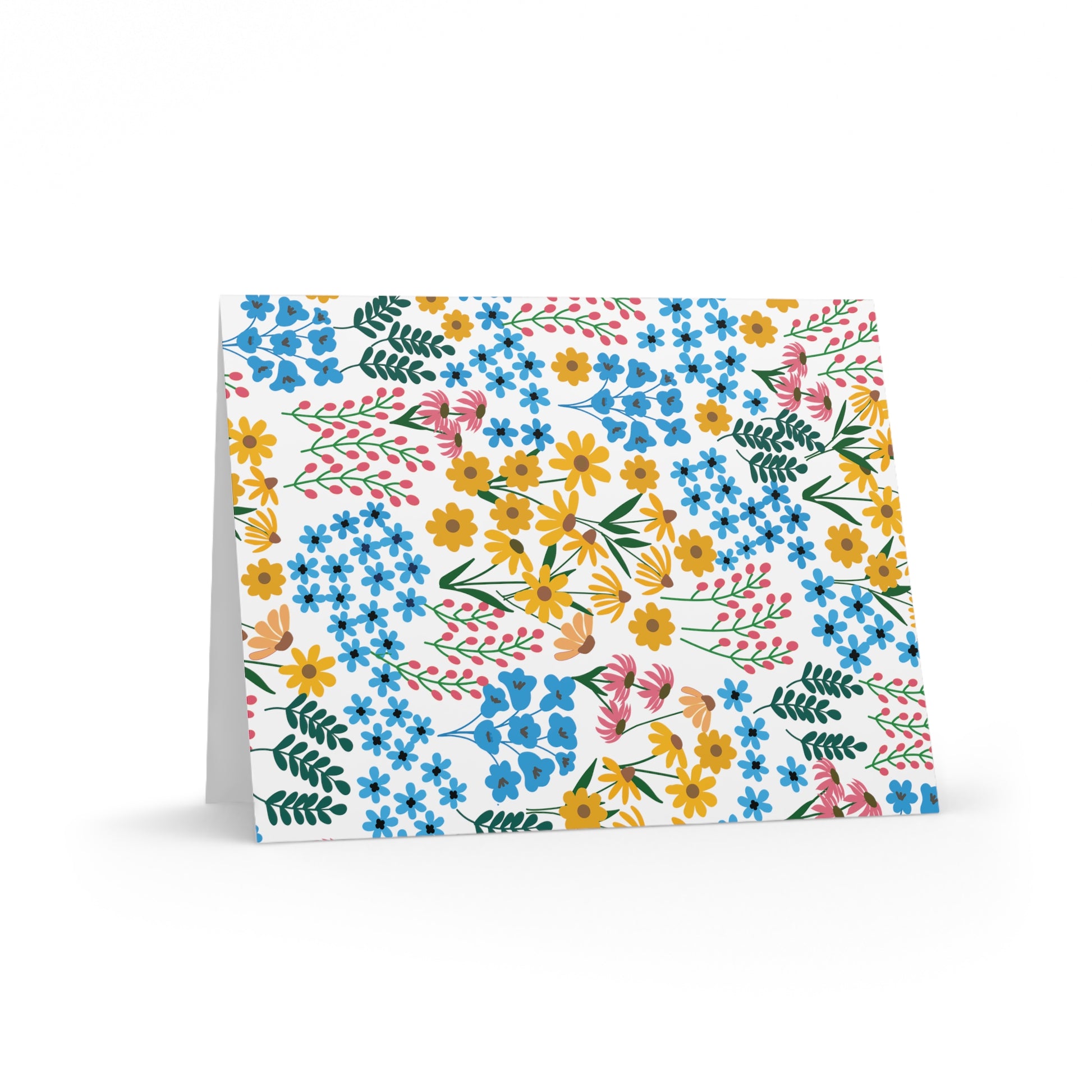 Floral Greeting Cards — Pack of 8/16/24: Tent-style card featuring vibrant hand-drawn wildflowers on a white background, embodying springtime freshness. Ideal for heartfelt notes, each includes a matching envelope.