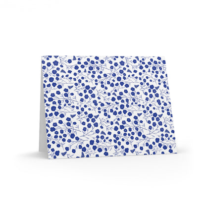 Floral Greeting Cards — Pack of 8/16/24 features a folded card with a blue-and-white floral pattern, offering a modern botanical look. Perfect for heartfelt messages, each card includes a matching envelope.