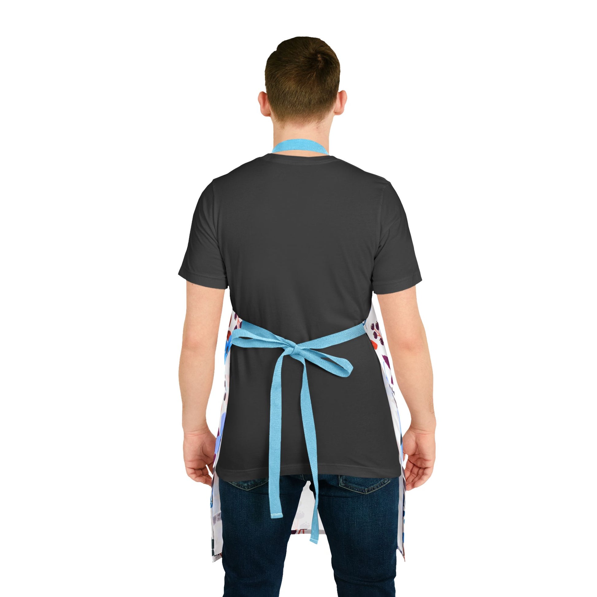 Floral Apron from FireBrook Designs: A back view of a person wearing a plain dark T-shirt and jeans, showcasing a white apron with sky-blue straps, highlighting its stylish and comfortable design.