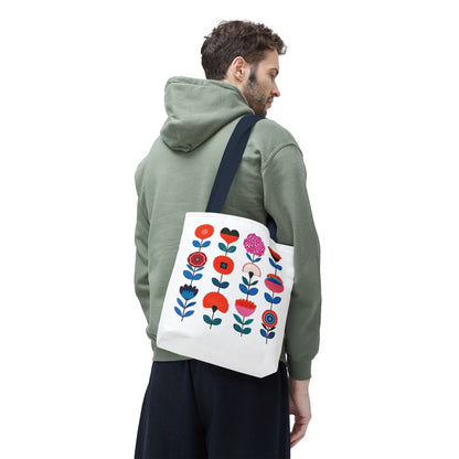 Floral Pattern Tote Bag held by a man in a green sweatshirt, showcasing its stylish floral design. Ideal for daily errands and outdoor adventures.