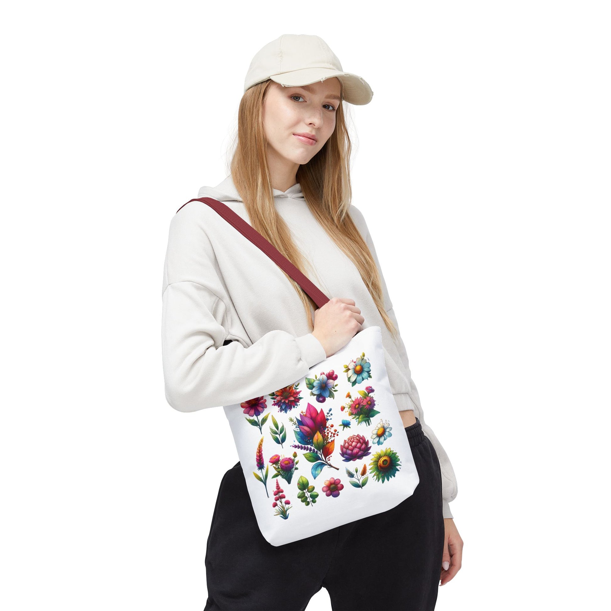 Floral Tote Bag held by a woman in a white sweatshirt, showcasing its flower design and sturdy build, ideal for daily use.