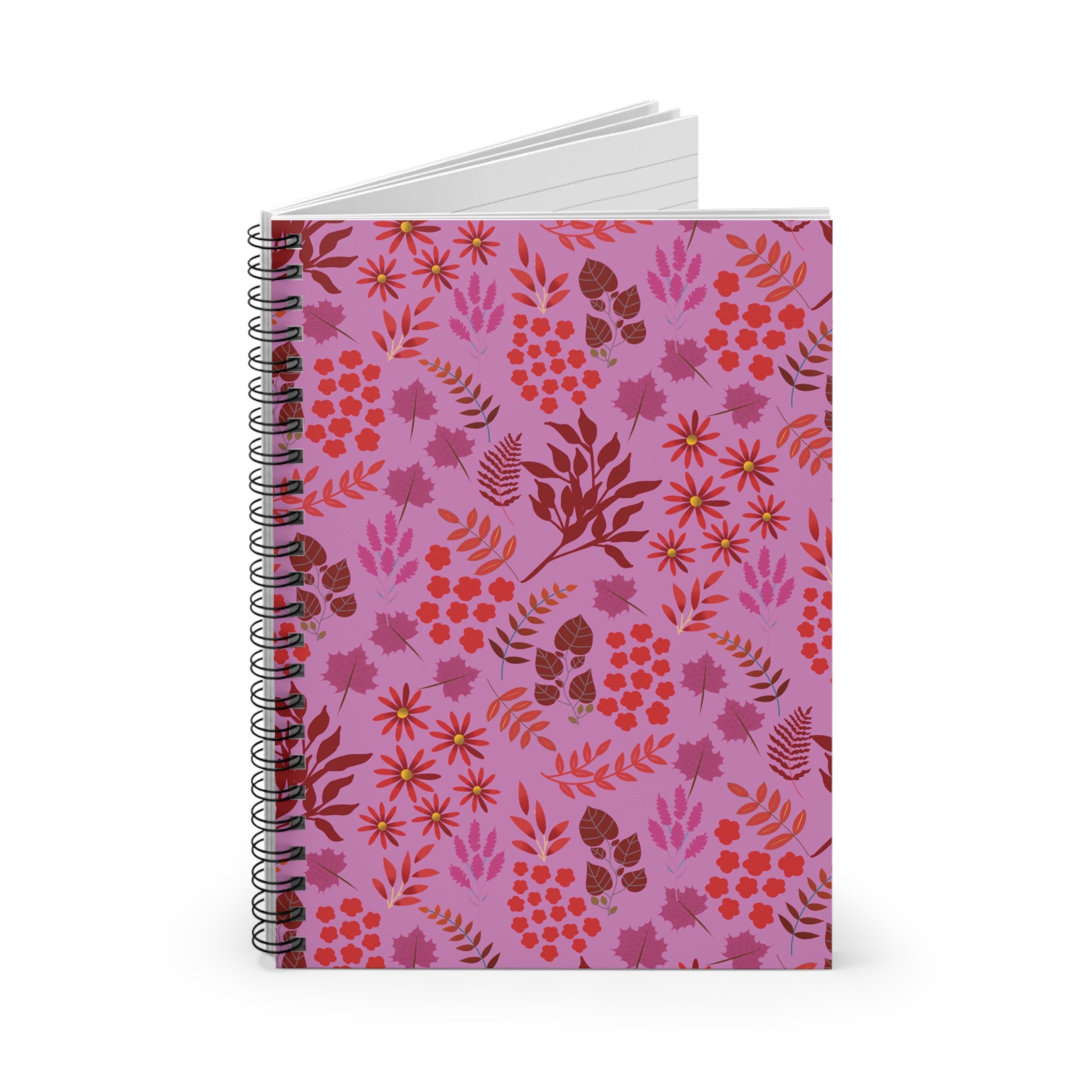 Floral Spiral Notebook with pinkish-purple cover featuring a red and magenta floral motif, standing upright with black wire-o binding and lined pages peeking out, epitomizing FireBrook Designs' uplifting style.