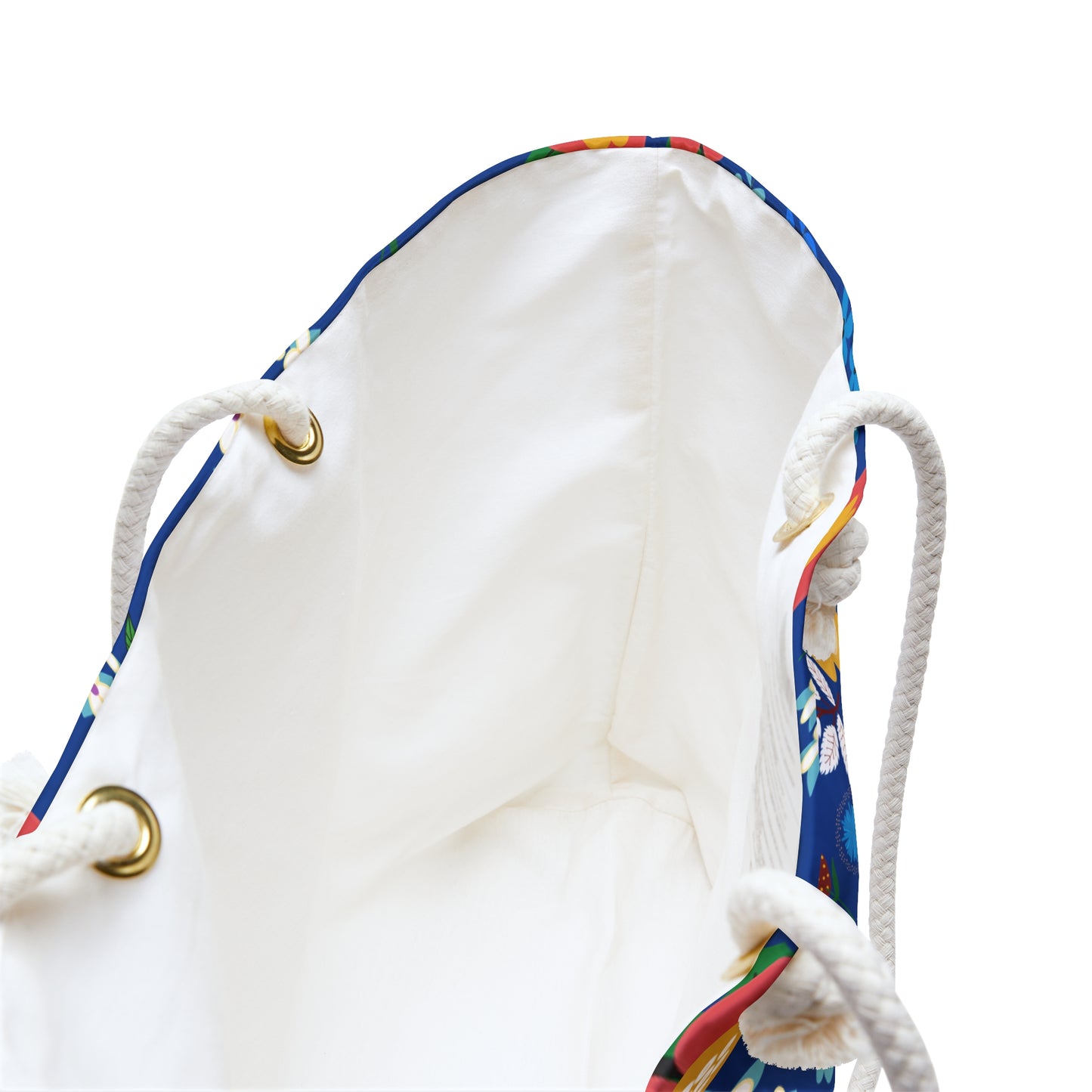 Weekender Bag's interior shown: cream lining, sturdy rope handles through metal grommets, and a glimpse of the colorful exterior, embodying FireBrook Designs' blend of comfort and style for joyful travels.