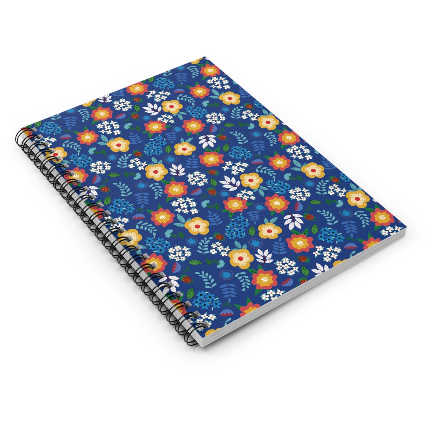 Floral Spiral Notebook with vibrant floral cover on deep blue, lying closed. Ideal for jotting notes or sketching, it embodies FireBrook Designs' uplifting style with durable spiral binding and eco-friendly paper.