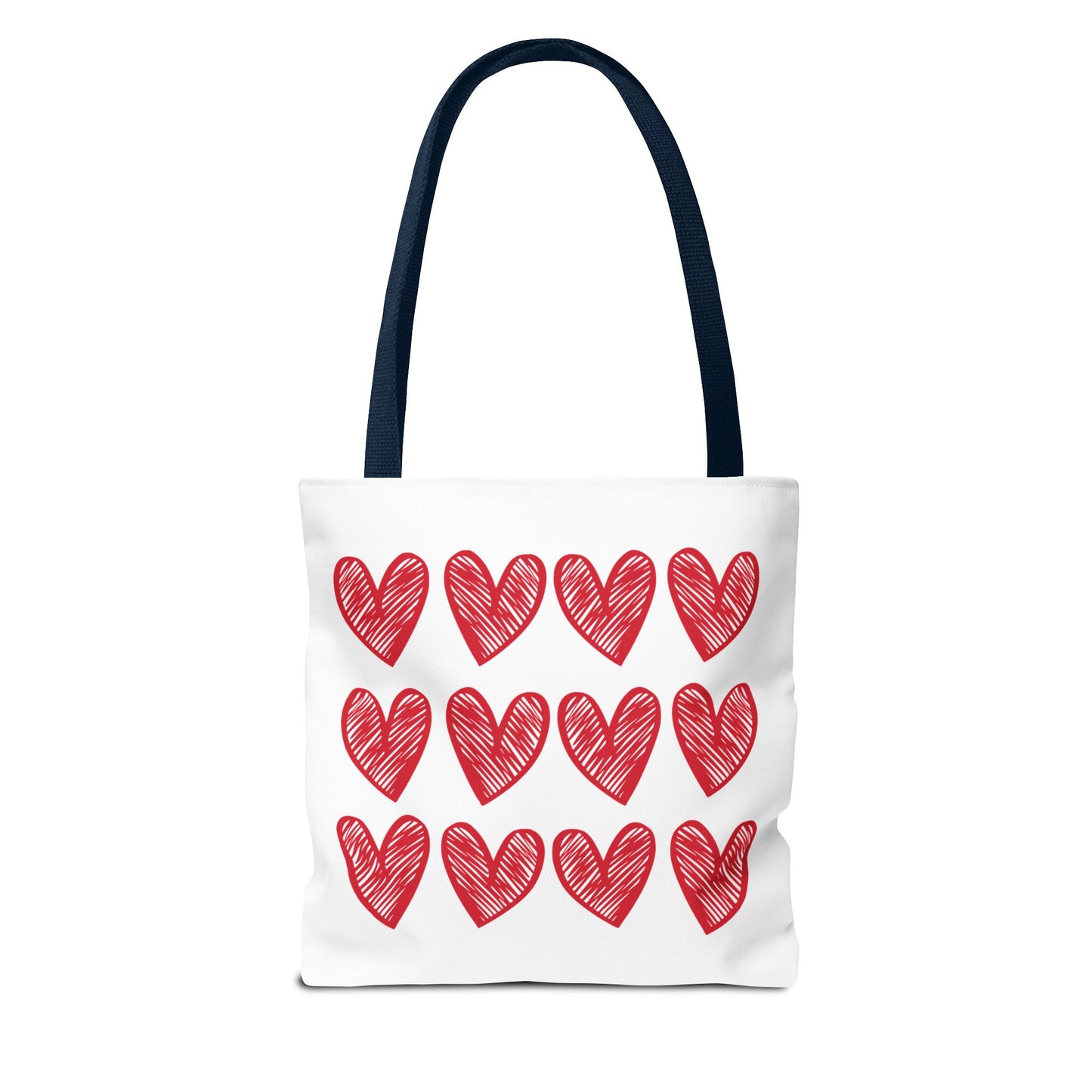 Hearts Tote Bag by FireBrook Designs, featuring a white body adorned with red hearts. Ideal for adding a playful touch to any outfit, it offers reinforced handles and boxed corners for durability and space.
