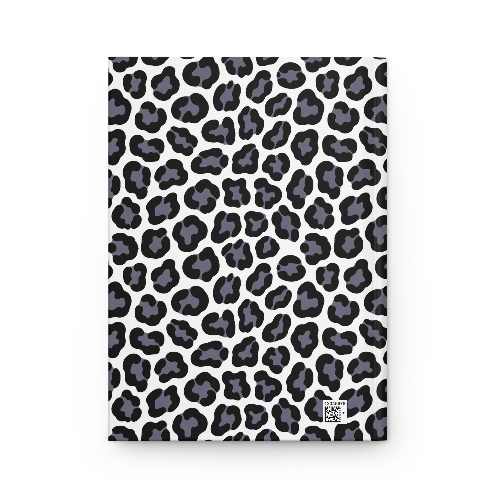 HARDCOVER JOURNAL, MATTE, RULED, 5X7, SEWN BIND, CLEAN-TEAR PAGES – LEOPARD, NEUTRAL COLOR features a white cover with stylized black leopard spots, includes a tiny QR-style code for product identification.