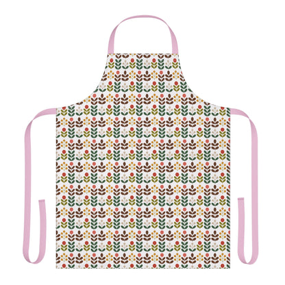 Flower Pattern Apron featuring vibrant floral designs, pink straps, and a comfortable fit, perfect for creative cooking or crafting. Ideal for adding a joyful, stylish touch to everyday tasks.