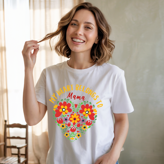 My Heart Belongs to Mama T-shirt: A unisex, garment-dyed tee with a classic crew neckline and relaxed fit, featuring double-needle stitching for durability, ideal for celebrating and appreciating moms.