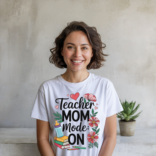 Teacher Mom Mode On T-Shirt featuring a relaxed fit and crew neckline, showcasing a playful design ideal for busy teacher moms, embodying the comfort and uplifting style of FireBrook Essentials.