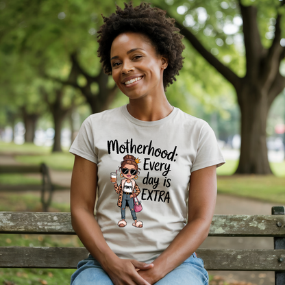 Motherhood: Every Day is Extra T-Shirt; a comfortable unisex tee with a heartfelt message, featuring durable double-needle stitching and soft garment-dyed fabric, perfect for celebrating motherhood daily.