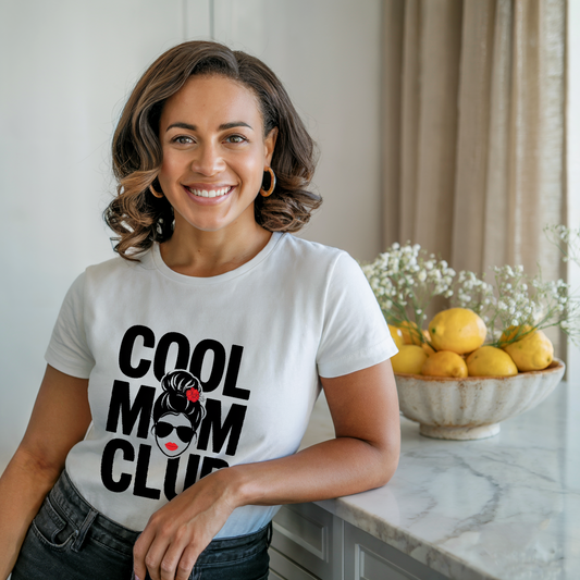 Cool Mom Club T-shirt featuring a relaxed fit and classic crew neckline, ideal for stylish moms. Double-needle stitching and garment-dyed fabric highlight its comfort and durability from FireBrook Essentials.