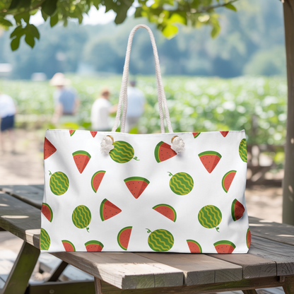 Watermelon Design Weekender Bag – Fun Summer Travel Tote displayed on a picnic table, showcasing its roomy interior and durable rope handles, ideal for beach trips or weekend getaways.