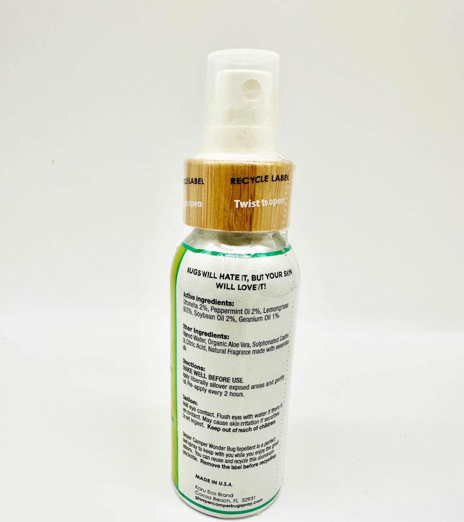 Glamper Camper Wonder Bug Repellent in a sleek, reusable aluminum spray bottle with bamboo-look cap, featuring natural ingredients like citronella and peppermint oils. Ideal for outdoor use, embodying FireBrook Essentials' commitment to joy and ease.